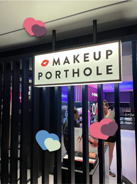 Makeup Porthole shop with lipstick kissing lips emoji on sign and